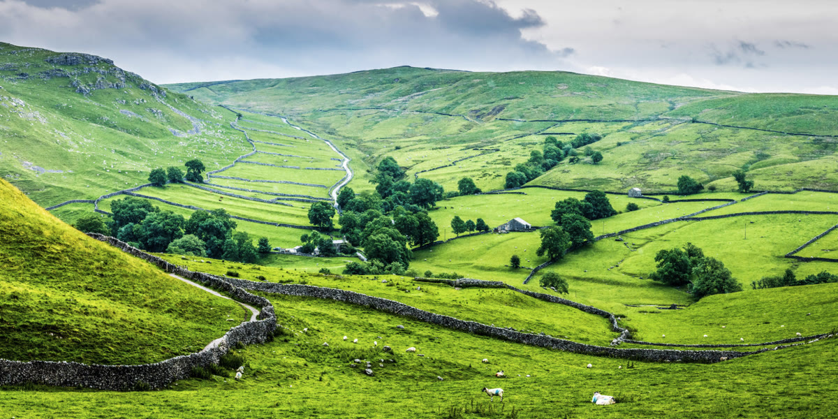 Green hills and stone walls in the United Kingdom